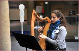 Miriam Gentle playing harp