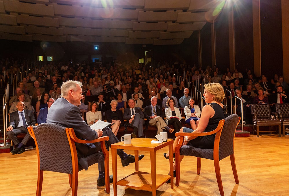 Dr. Marshall and Katie Couric sit onstage with an audience before them