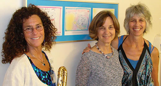 Georgetown Lombardi Arts and Humanities Program Director Nancy Morgan with cartoonist, Amy Marash and flutist, Laura Sperling