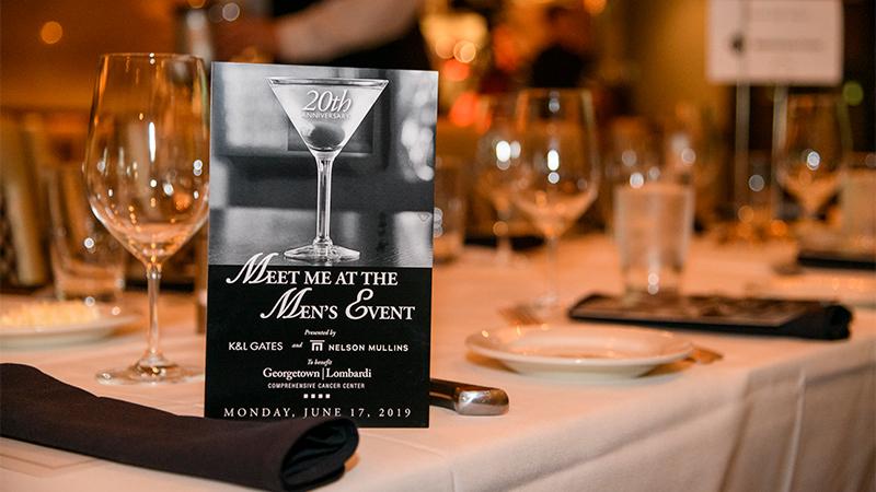 Men's event table setting with invitation