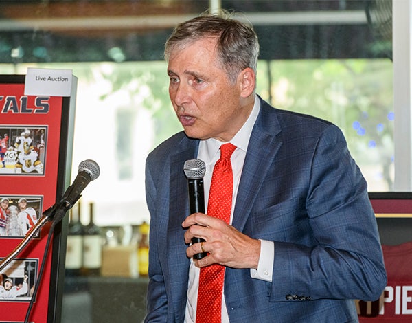 Dr. Weiner speaks at a podium