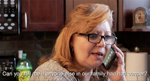 A woman speaks on a cell phone