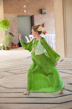 Dancer in green, flowing dress.