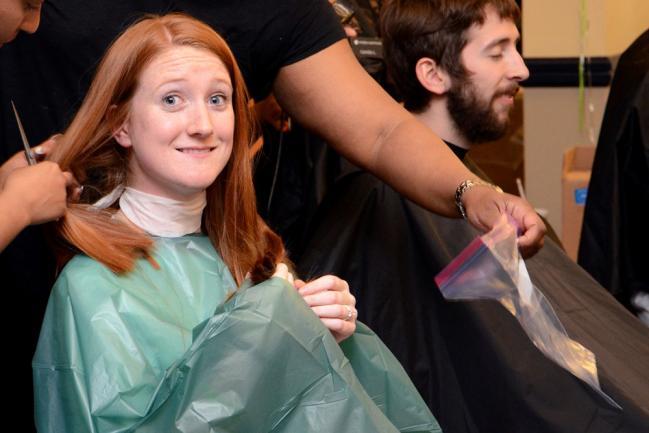 A woman prepares to get her hair cut