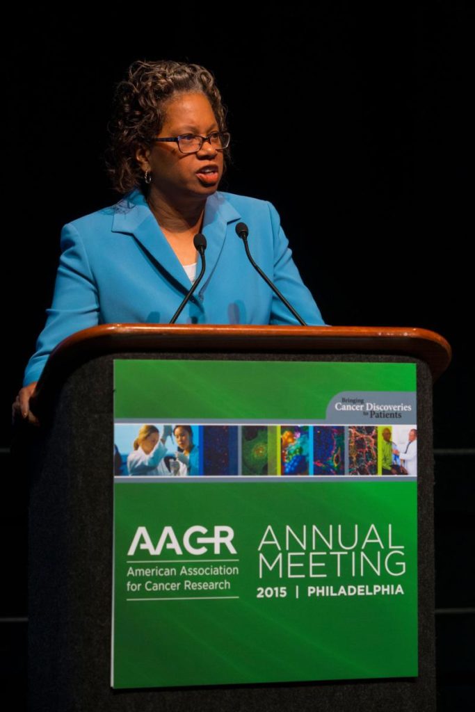 Lucile Adams-Campbell speaks from behind a podium