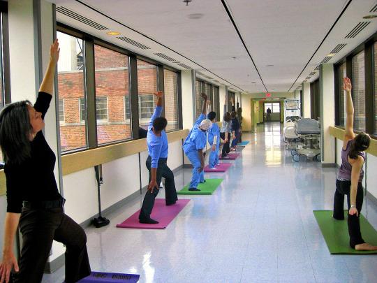 People doing yoga in a hallway