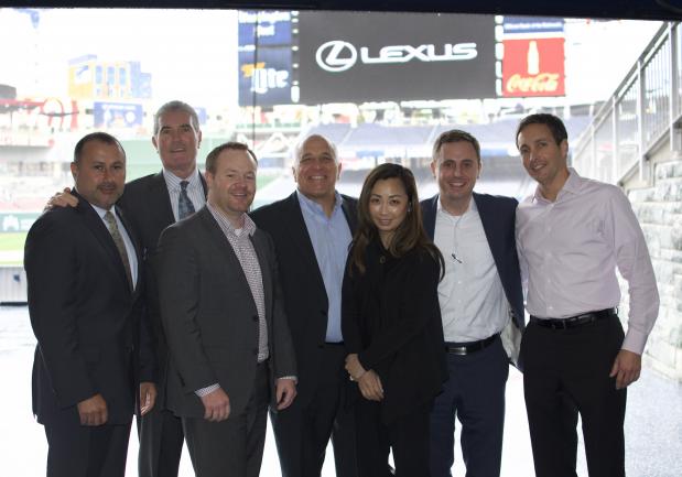 A group of people stand together at an arena