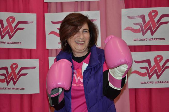 Jeanne Mandelblatt wears pink boxing gloves in celebration of the Walking Warriors debut