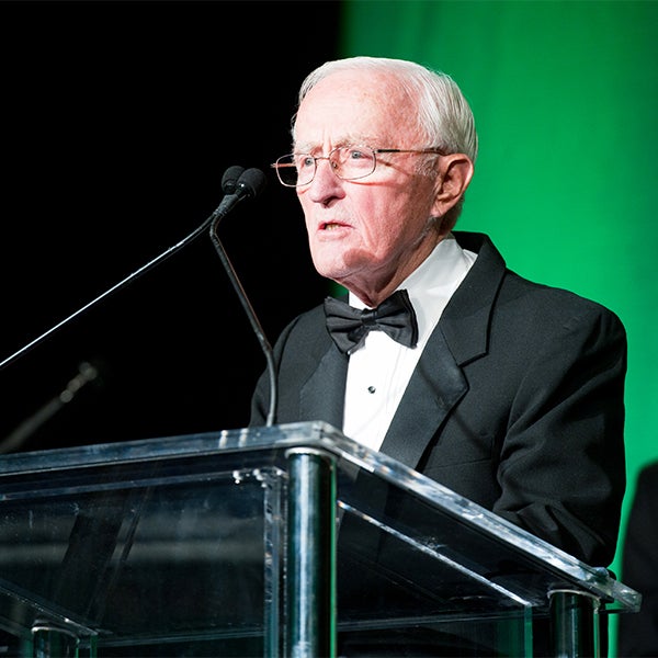 John Potter, MD, spoke at a podium during the Lombardi Gala in 2010