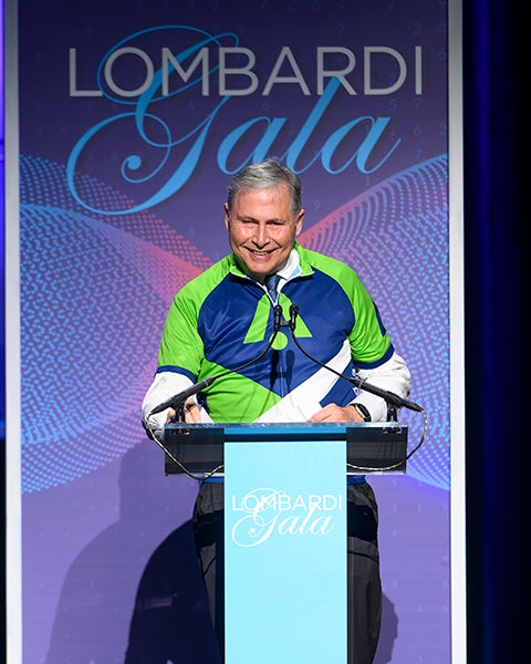 Dr. Weiner speaks at a podium