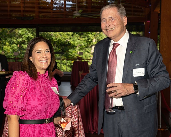 Jennifer Drake stands next to Dr. Weiner