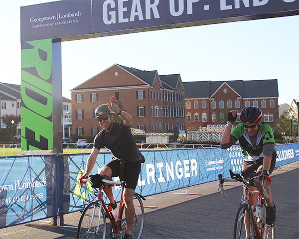 Wayne Fogler and another rider cross the finish line