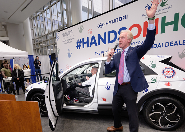 Jeff Petro starts the car with the winning key while Kevin Reilly cheers him on