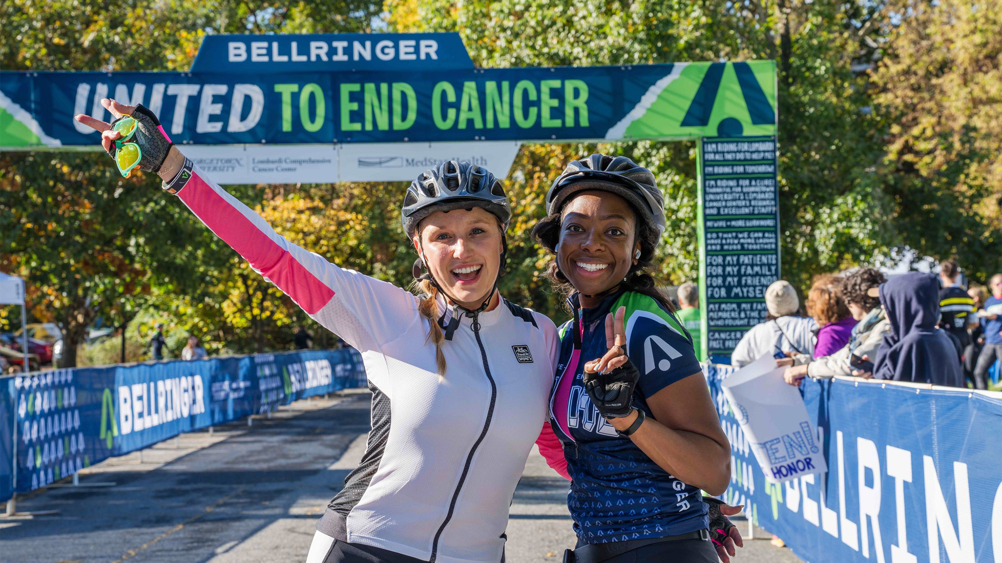 Two women celebrate at the 25-mile finish line at this year's BellRinger