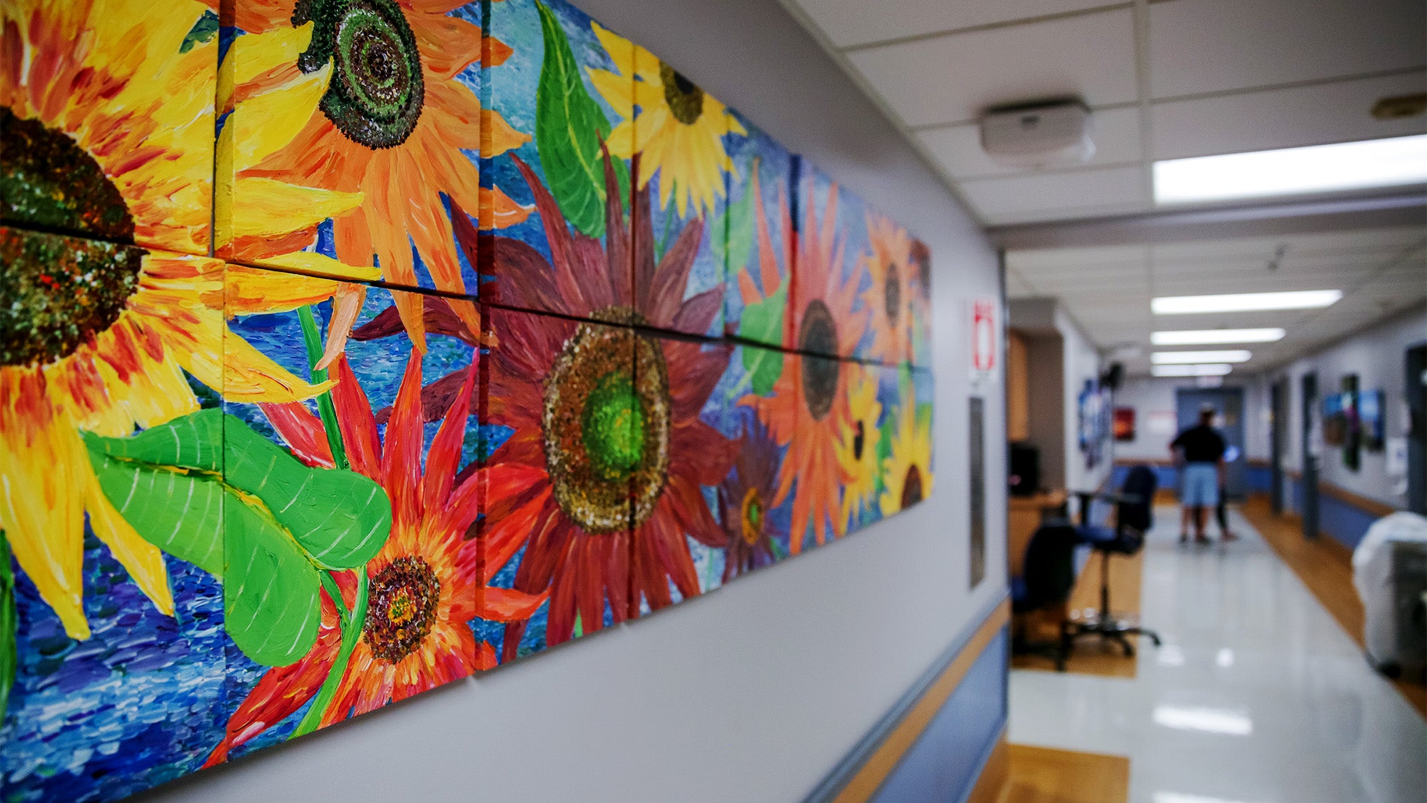 Hospital hallway decorated with colorful mural