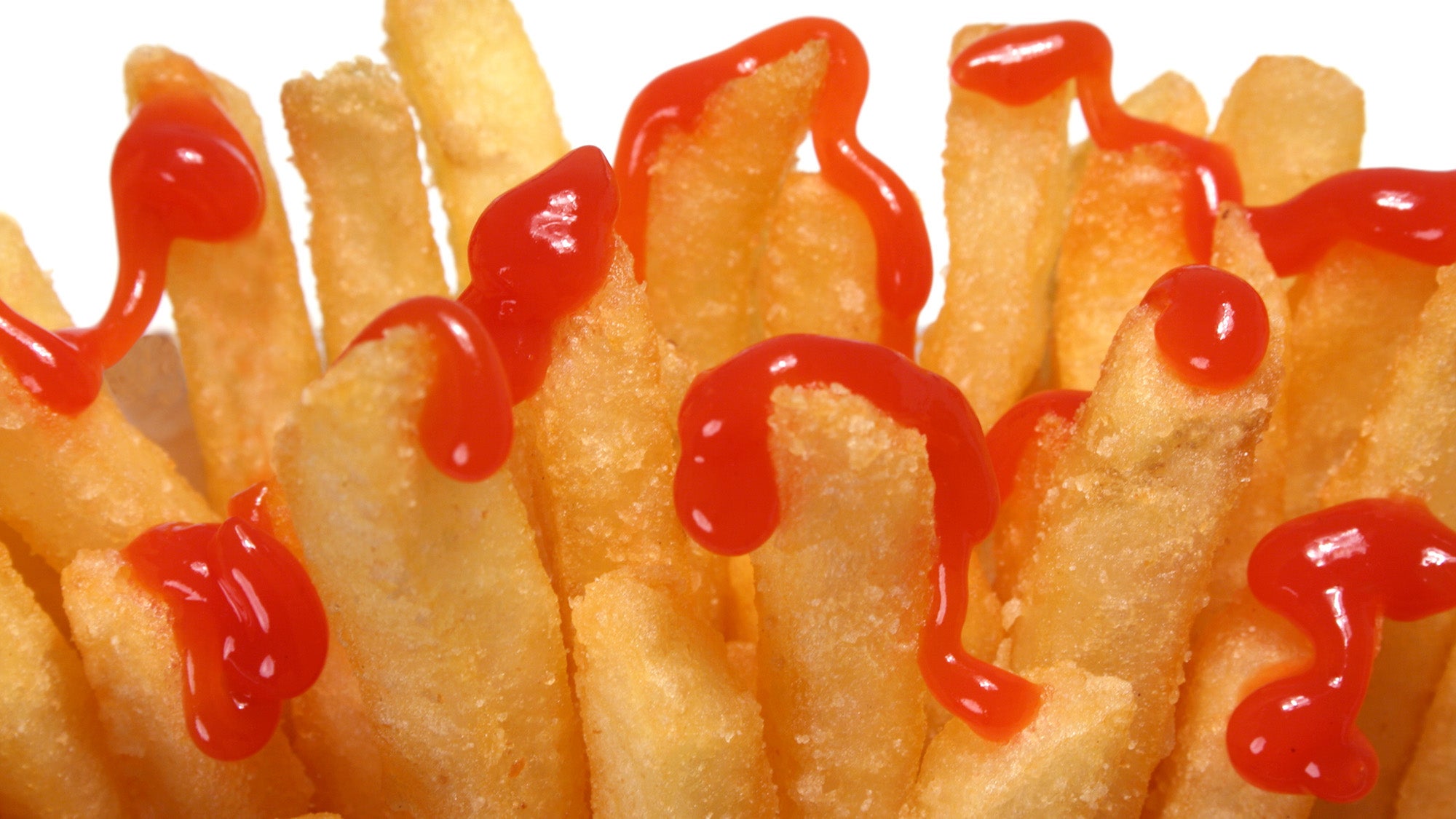 French fries drizzled with ketchup