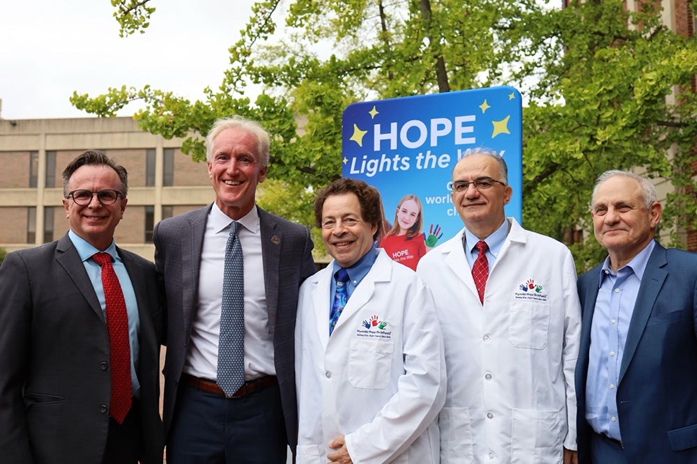 Beauchamp, Reilly, Toretsky, Uren and Atkins stand side by side at the event