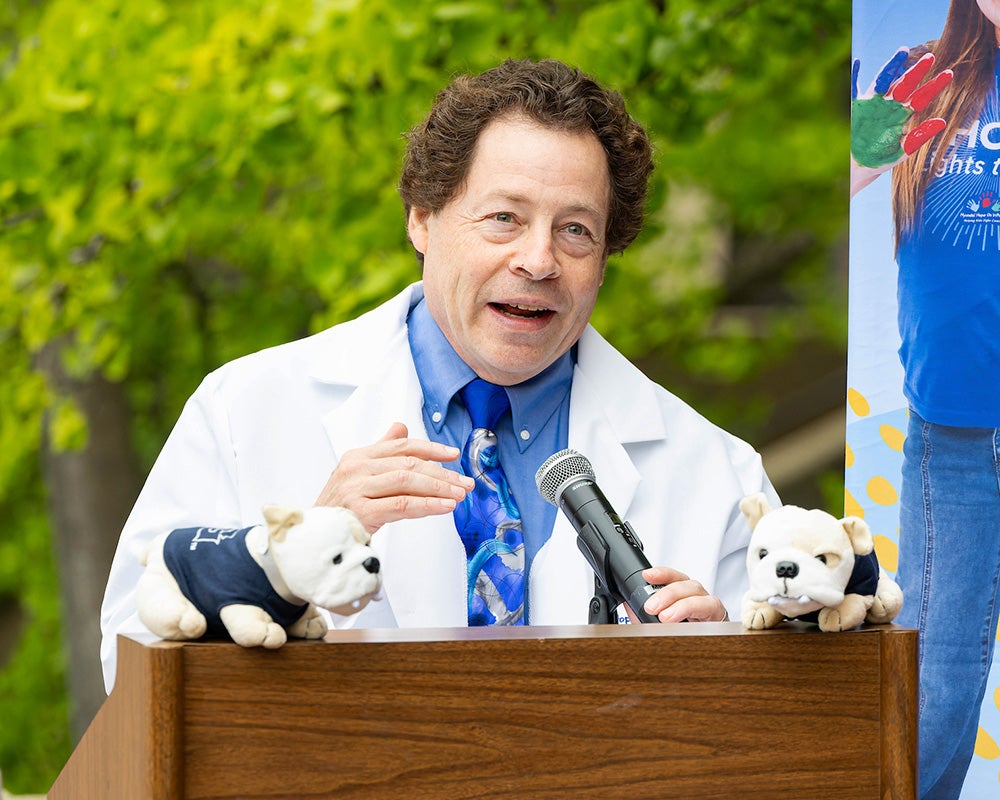 Dr. Toretsky speaks from a podium at the event