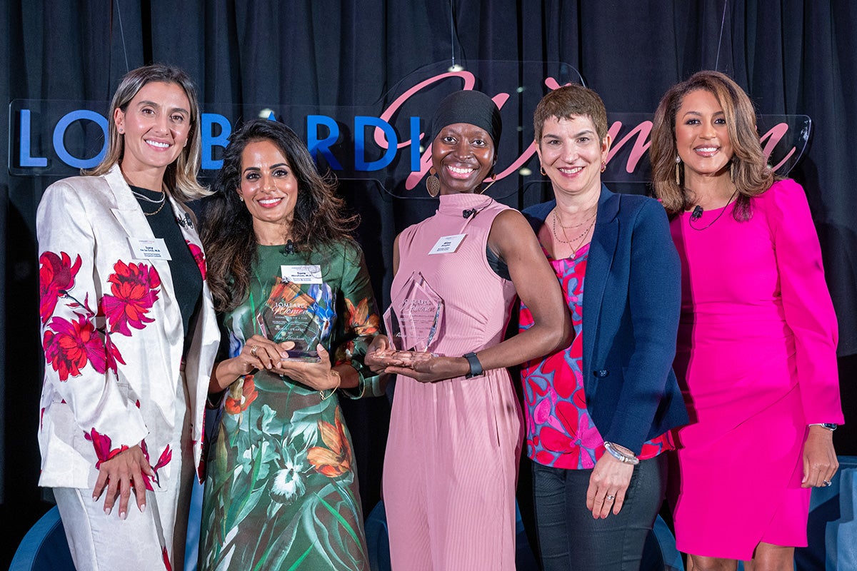 The evening's panelists and awardees stand together