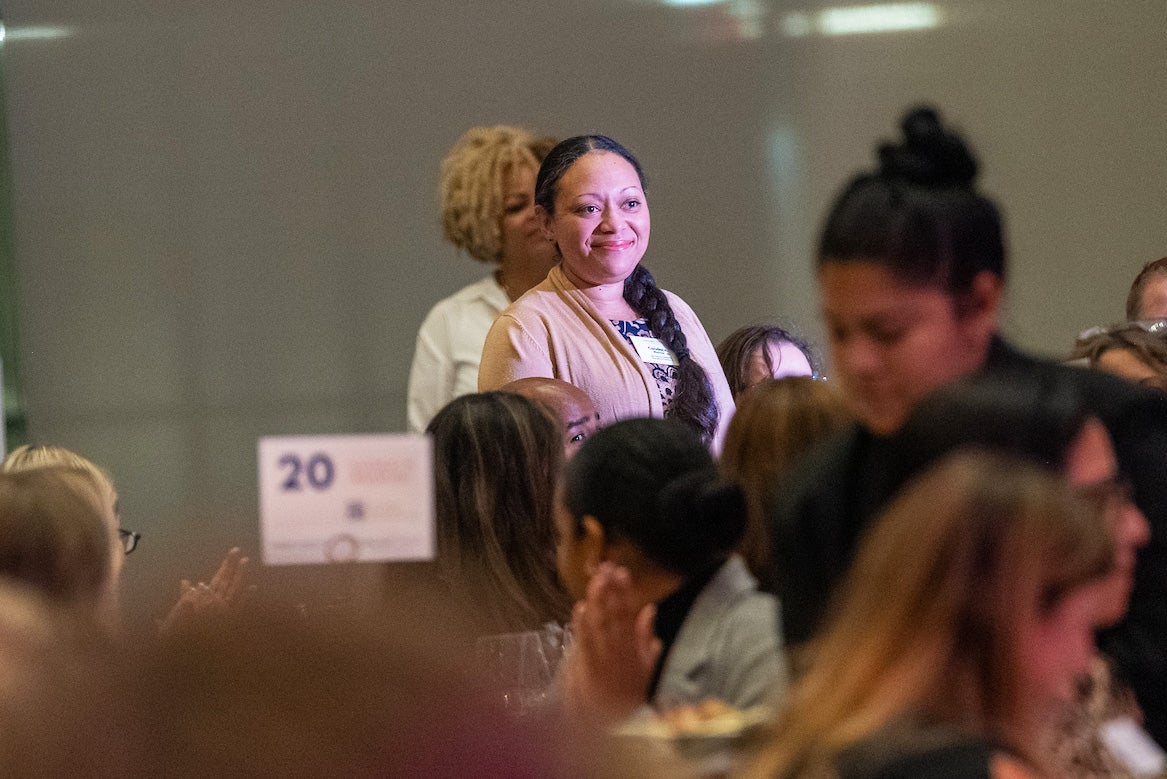 Candace Mainor, MD, stands to be recognized by attendees