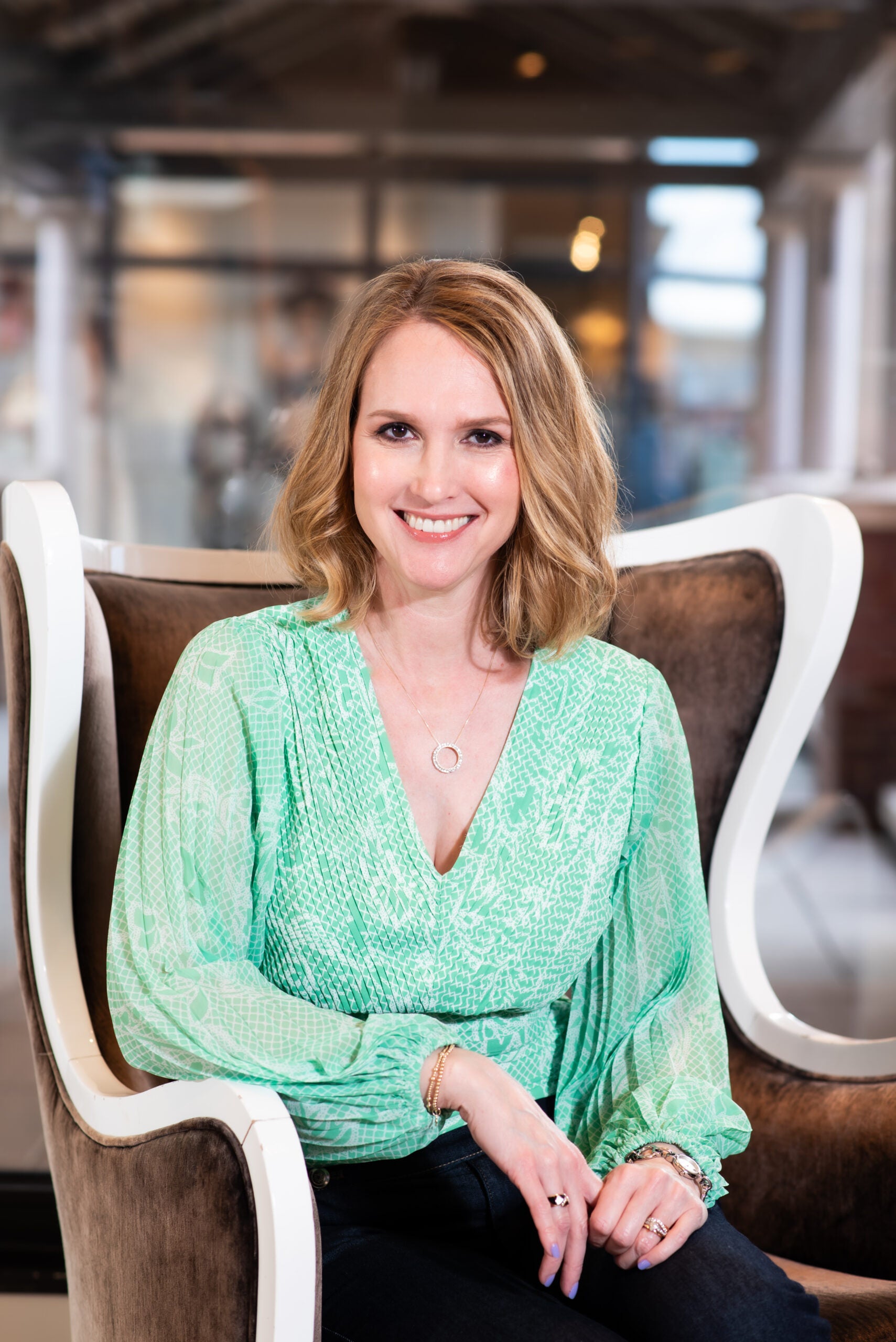 Christy Foldenauer seating in a white chair