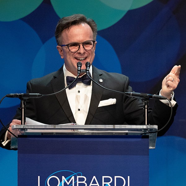 Norman J. Beauchamp speaks from a podium at the gala