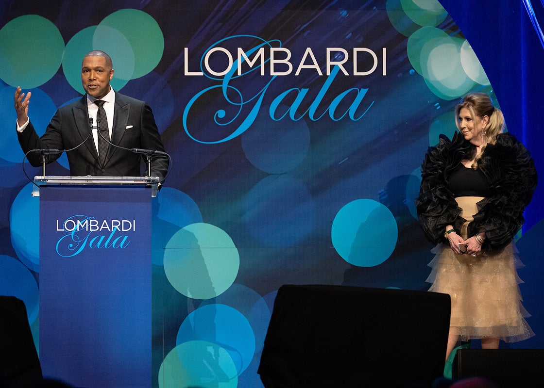 Wes Hall and Sherrie Beckstead stand onstage at the gala