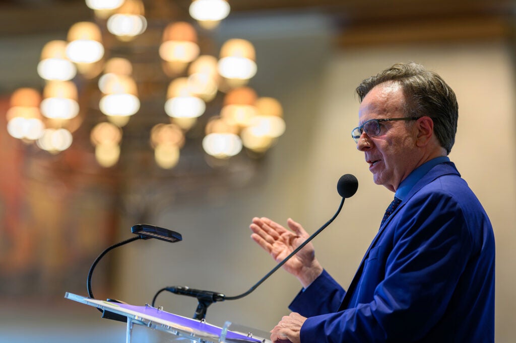 Dr. Beauchamp speaks from a podium