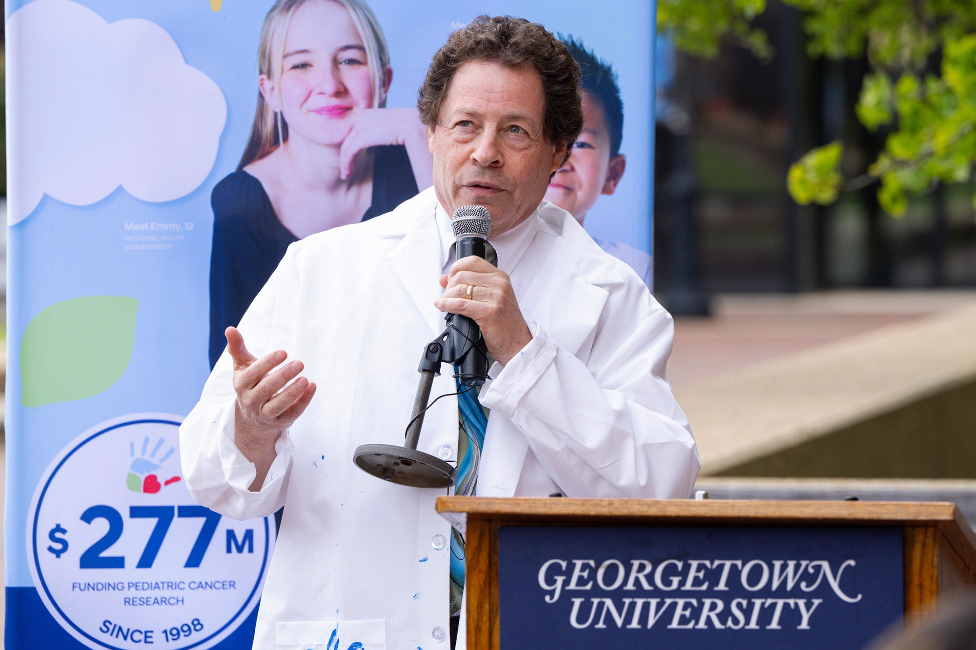Jeffrey Toretsky speaks from a microphone outdoors