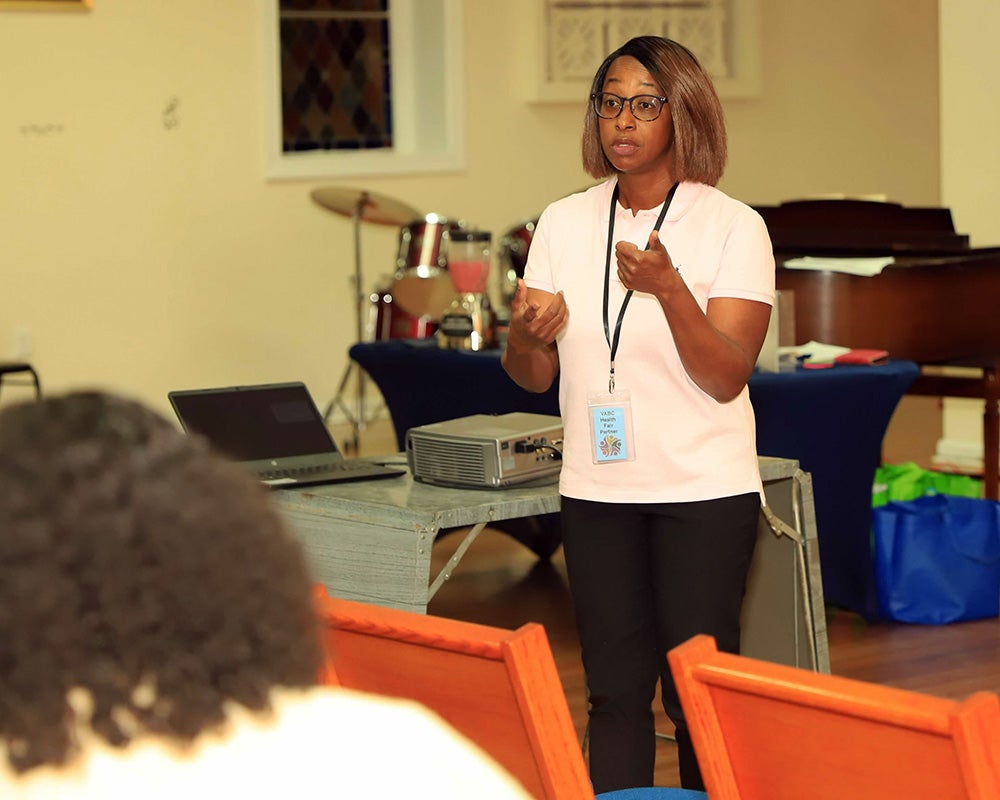 Mireille Bright speaks to a church audience