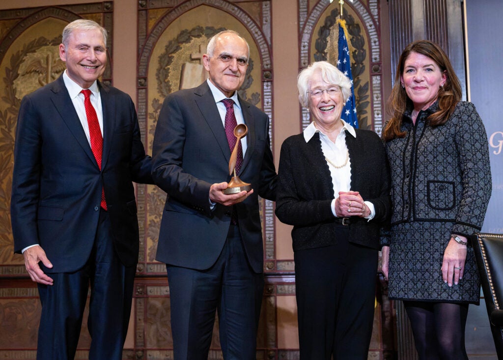 Dr. Weiner, Dr. Haddad, Mrs. Kovach and her daughter Alex stand together onstage in Gaston Hall