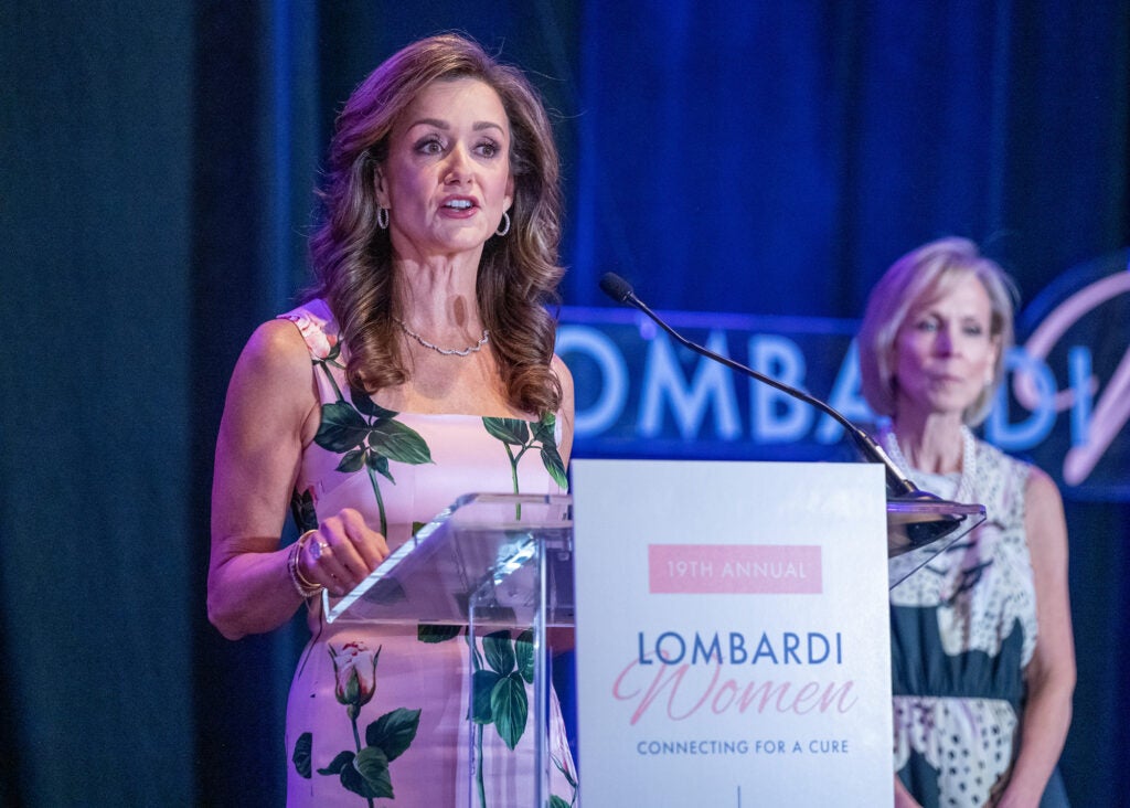 Jennifer Bognet speaks from a podium