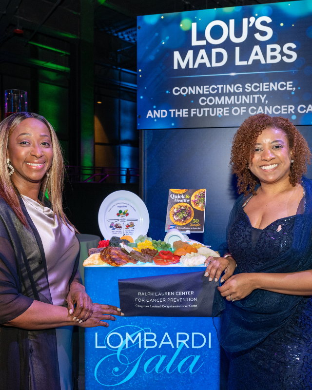 Presenters at Lou's Mad Labs smile at their station at the 2025 Lombardi Gala