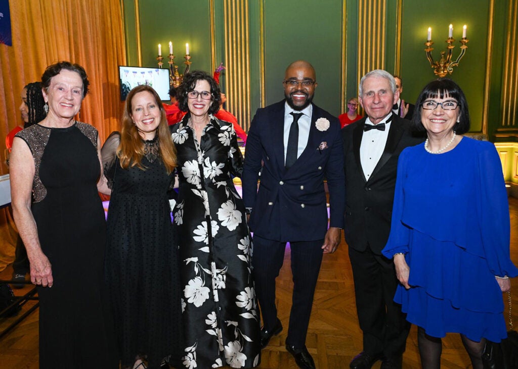 Six people stand together