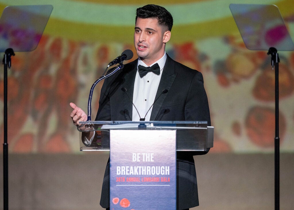 Marcelo Sleiman Jr. speaks from a podium