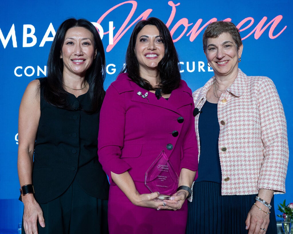 Three women stand together