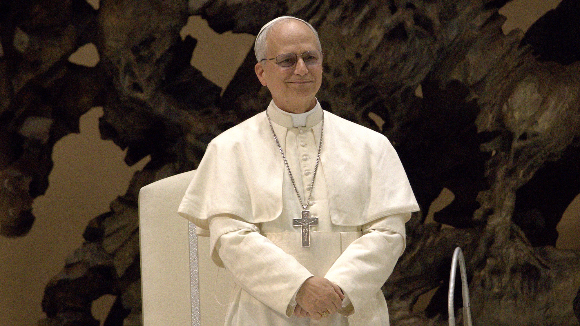 Pope Leo stands during a media event